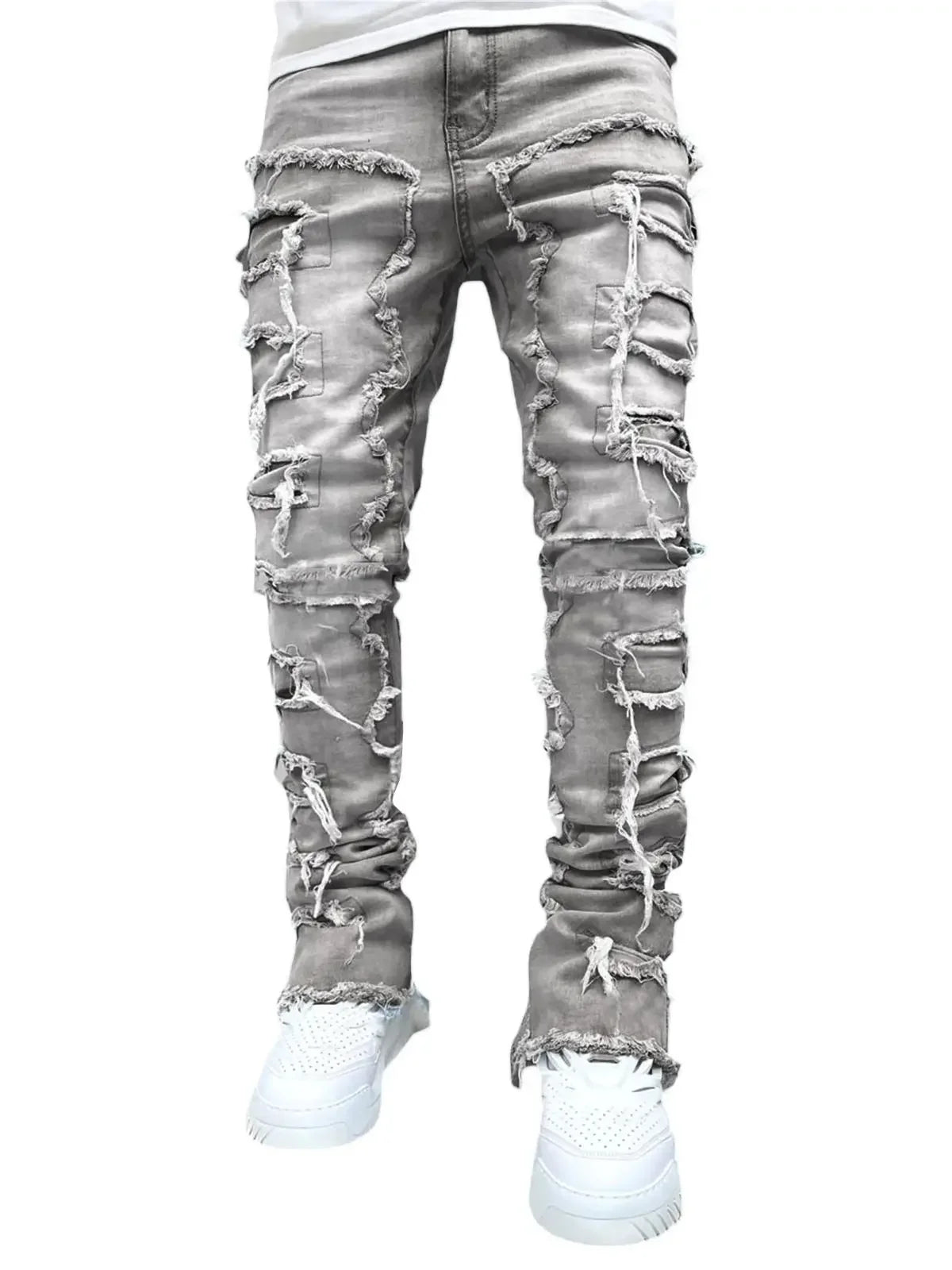 Grey denim jeans with heavy ripped detailing and a fitted silhouette for a casual outfit.