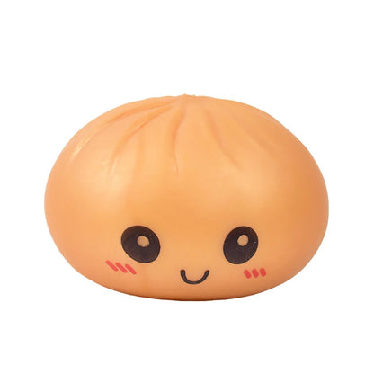 Beige silicone dumpling squishy fidget toy with a smiling face for stress relief.