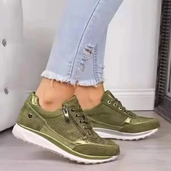 Olive green wedge sneakers with metallic details, side zip, and breathable mesh for casual daily wear.