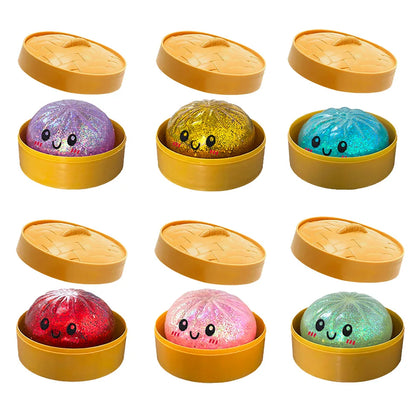 Glittery, colorful dumpling squishy fidget toys with happy faces in yellow plastic steamer pots for sensory play.