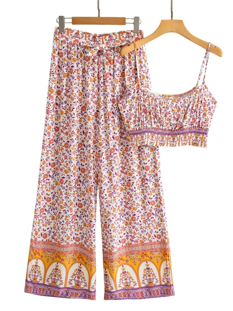 Flowy floral two-piece clothing set with a crop top and high waist wide leg pants for a comfortable summer look.