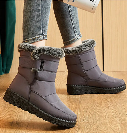 Gray waterproof ankle snow boots with faux fur trim and black rubber soles.