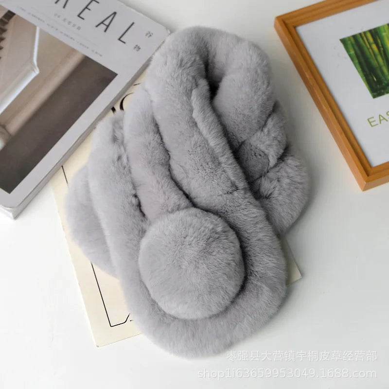Thick grey rabbit fur winter scarf with a plush pom-pom accent.