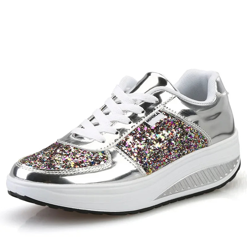 Silver metallic and multicolored glitter lace-up sneaker with a thick white wedge sole.