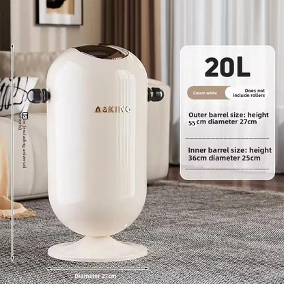 Cream-white cylindrical trash can with dark lid and pedestal base on a grey carpet.