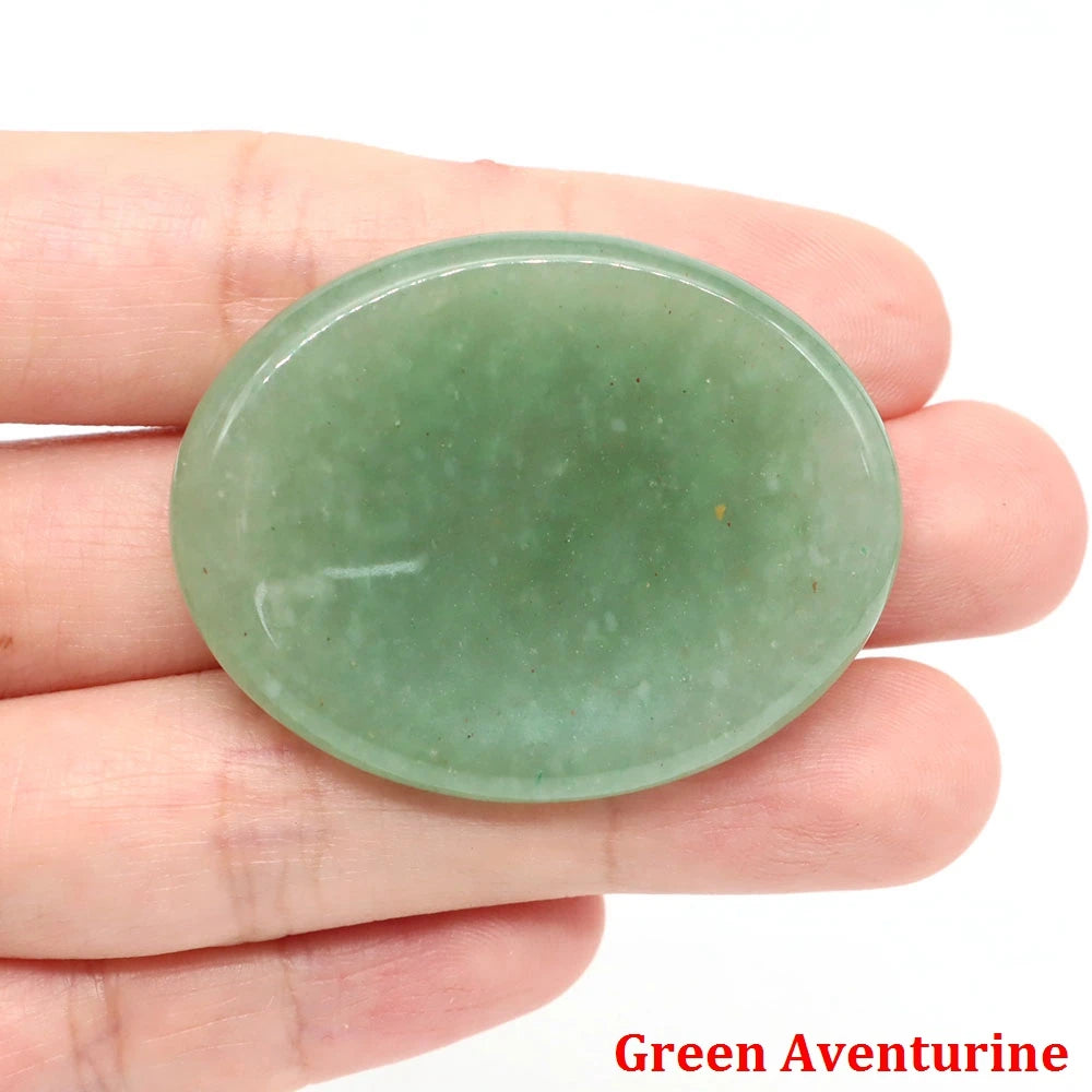 Smooth oval green aventurine palm stone for home decor meditation.