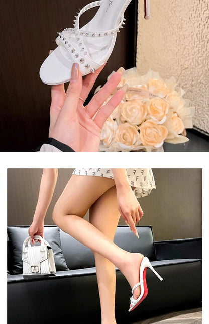White open toe high heel sandals featuring silver rivets and a slim heel, suitable for formal evening wear.