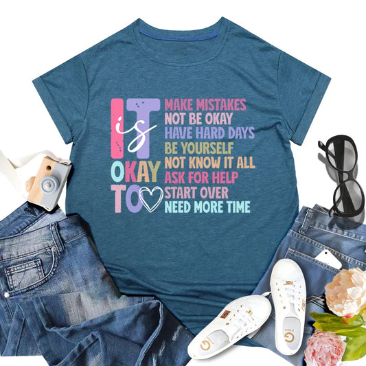 Blue short-sleeve t-shirt with multicolored mental wellness text graphic