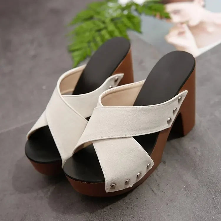 Off-white faux suede platform sandals with rivet details and a brown block heel for summer outings.