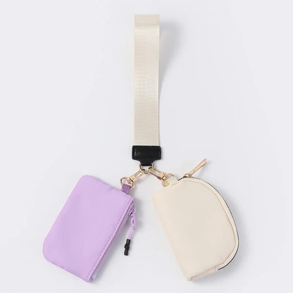 Lavender and cream nylon dual pouch wristlet wallet with zip closure for holding cards and keys on the go.