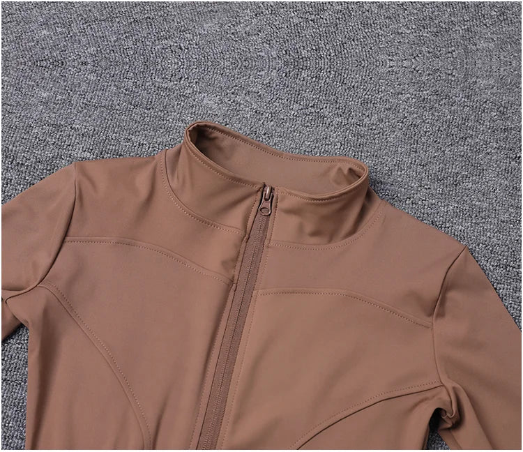 Brown fitted polyester sport jacket with a zip closure for gym training and yoga.