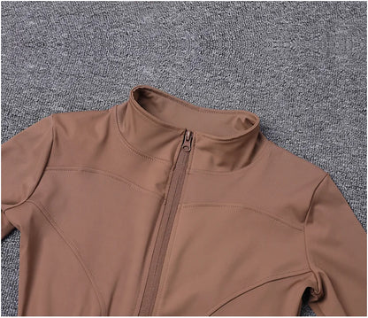 Brown fitted polyester sport jacket with a zip closure for gym training and yoga.