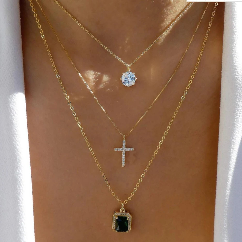 Layered necklace crystal pendant set featuring rhinestones and multiple chains