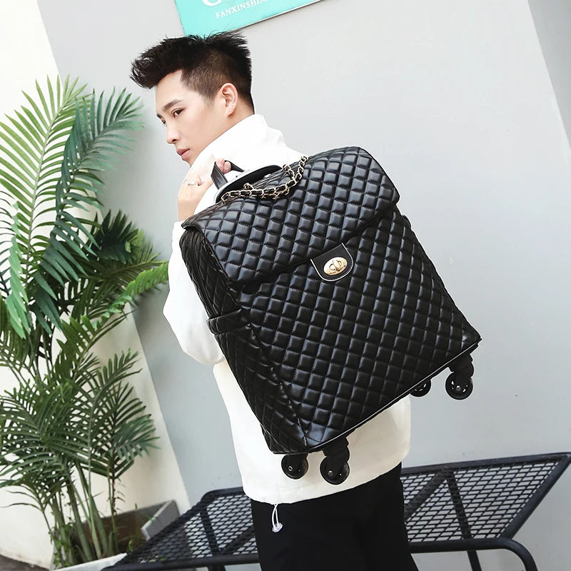 Black quilted PU leather rolling luggage with a gold turn-lock closure and gold chain handle detail.