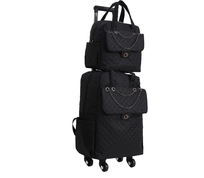 Black quilted nylon rolling luggage set with chain accents on front flap pockets and matching handbag.