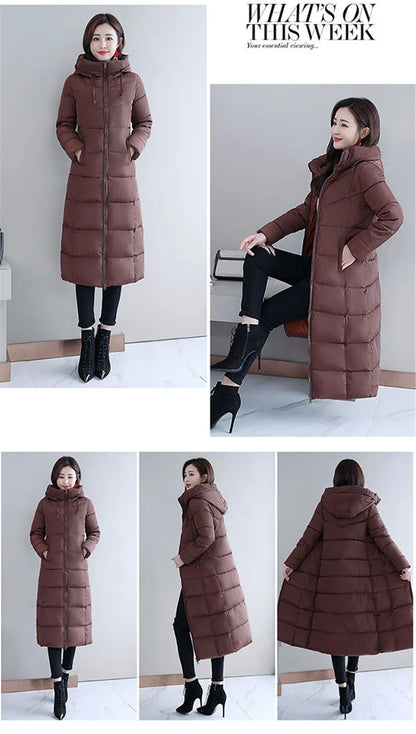 A woman models a long, brown quilted puffer coat with a hooded, zippered design.