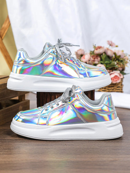 Metallic holographic lace-up sneakers with thick white soles and sparkly silver laces.
