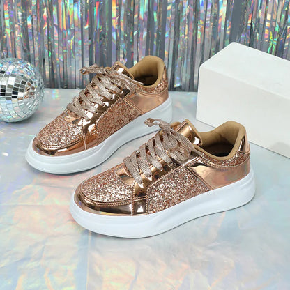 Rose gold glitter lace-up sneakers with thick white soles and metallic trim.