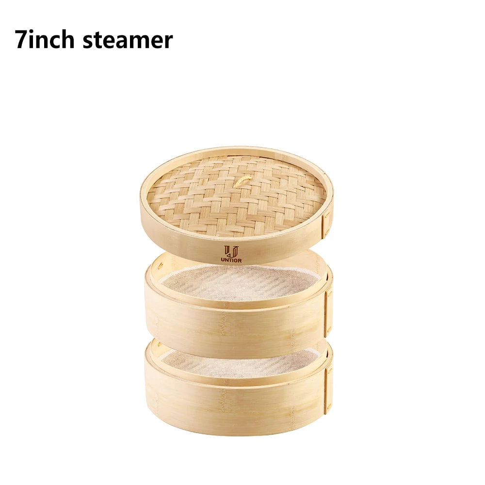 Natural beige bamboo two-tier dumpling steamer with lid and cloth liners.