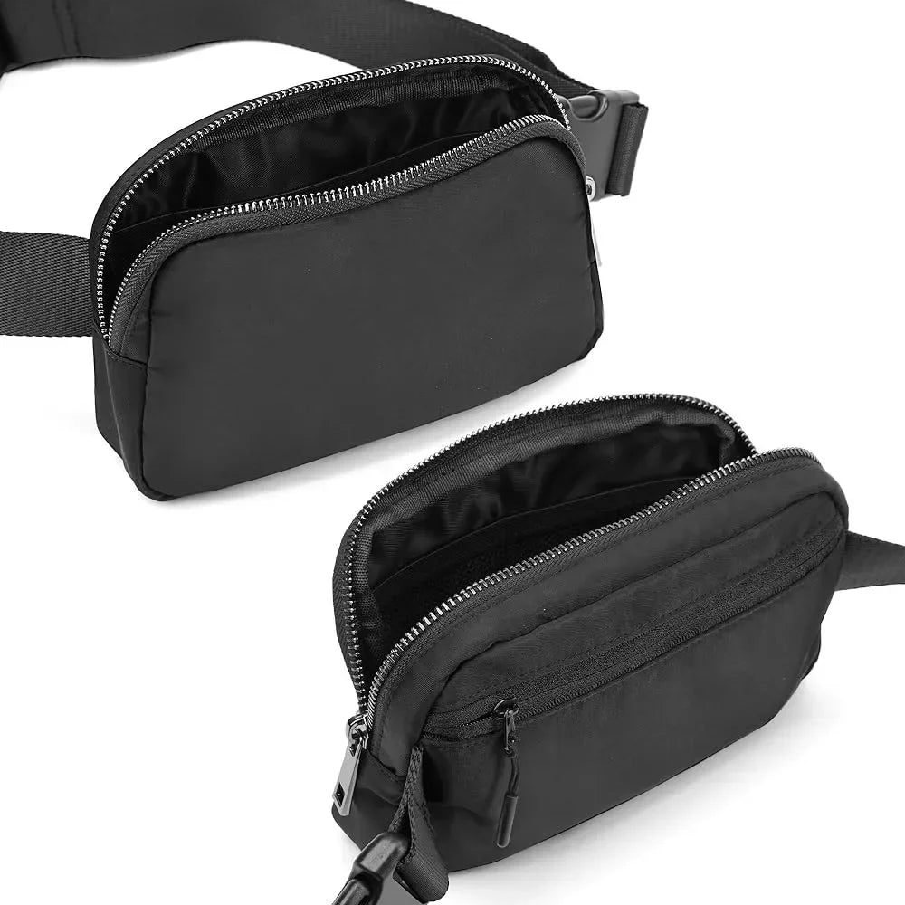 Black waterproof crossbody bag with zip closure and adjustable strap for running or yoga.