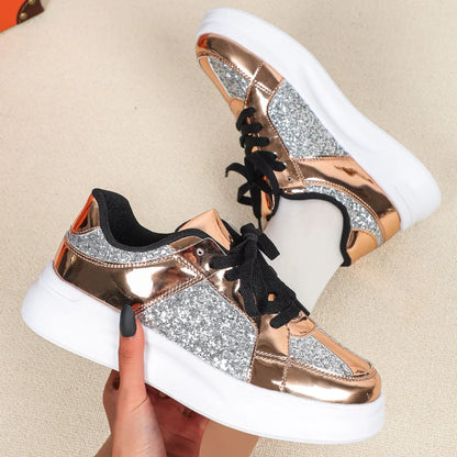 Rose gold and silver glitter casual sneakers with thick white soles and black laces.