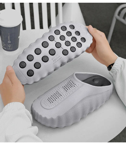 Grey slip-on sandals with a cushioned thick sole and non-slip tread for daily wear.
