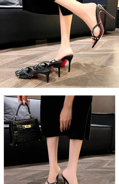 Black open toe sandals with silver rivets and red soles, these slim heel shoes are for evenings out.