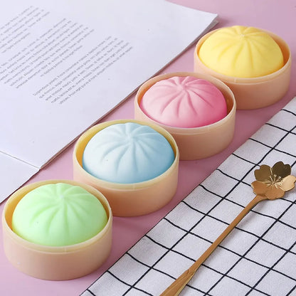 Multi-colored soft silicone dumpling and steamed bun squishy fidget toy set for sensory stress relief.