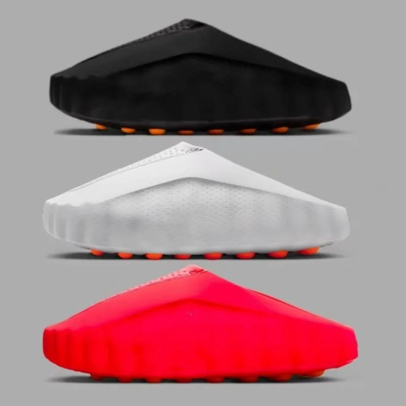 Black, white, and red EVA slip-on sandals with cushioned massage soles for comfortable daily wear.