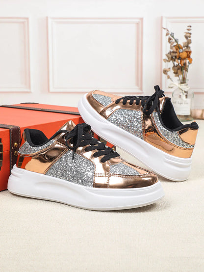 Rose gold and silver glitter casual lace-up sneakers with thick white soles.