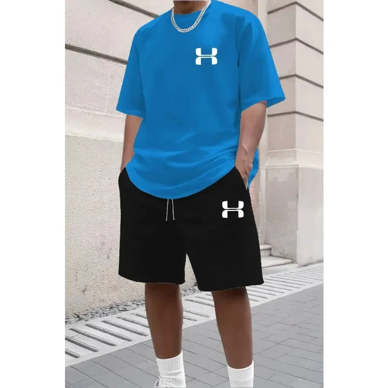 Blue and black knit set with relaxed fit short sleeve tee and shorts, for casual athletic wear.