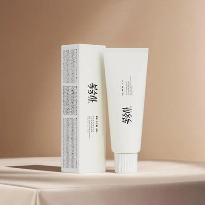 White Peach Jo+ rice extract moisturizing cream tube and matching rectangular box with black text.
