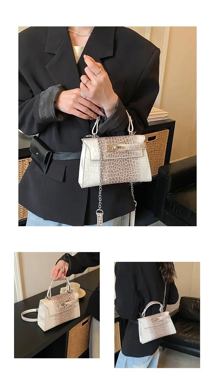 White and beige faux leather structured diaper bag with a chain strap for carrying baby essentials.