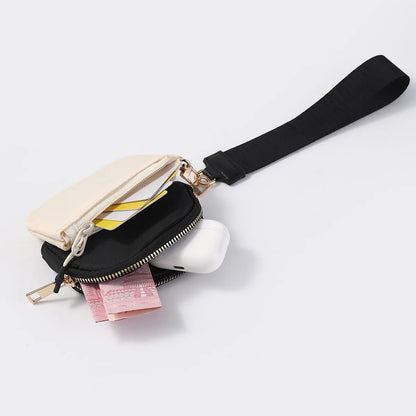 Beige and black nylon dual pouch wristlet wallet with zip closure for holding cards and cash on the go.