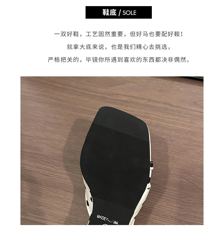 Black non-slip sole on white polka dot wedge heel sandals for casual wear.