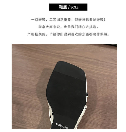 Black non-slip sole on white polka dot wedge heel sandals for casual wear.
