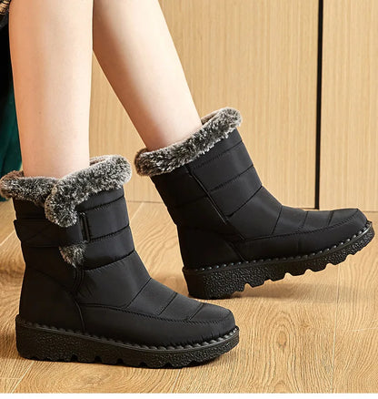 Black waterproof nylon winter snow boots with faux fur trim and lug soles.