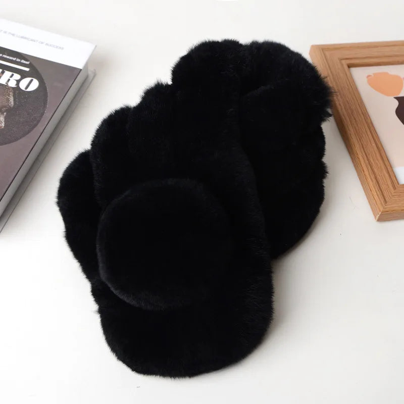 Short black faux fur winter scarf with a plush triple-tube design and a pom-pom detail.