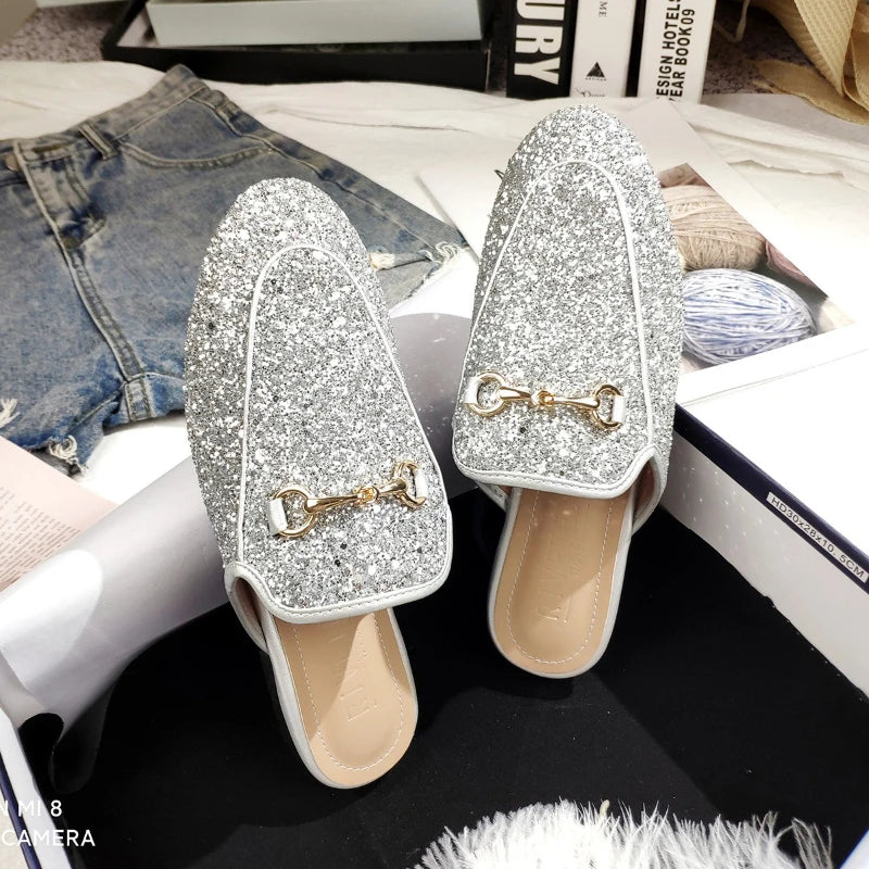 Silver glitter slip-on shoes with gold chain detail for all day wear.