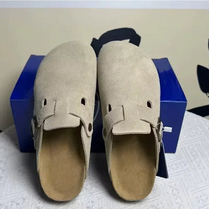 Beige suede mules with adjustable buckle straps are non-slip sandals for casual spring wear.