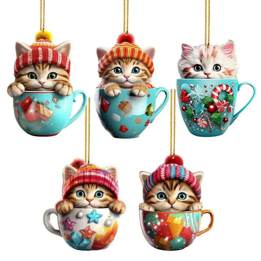 Five acrylic cat ornaments showing kittens in festive holiday teacups with hanging strings.