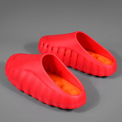 Bright red rubber platform sandals with a textured, slip-on design for comfortable all-day wear.