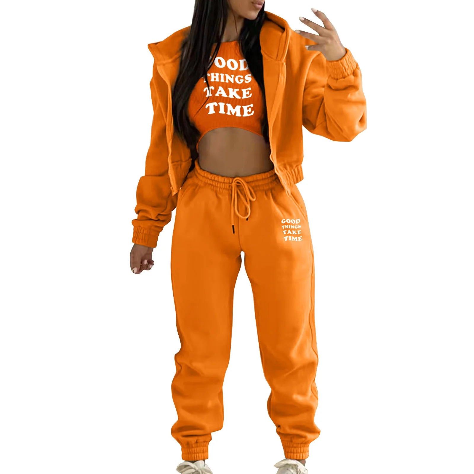 Orange relaxed knit sweater set with white letter print, featuring a hooded jacket and high waist pants for loungewear.