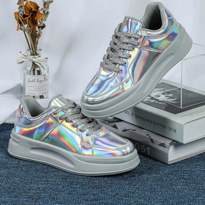 Holographic silver casual walking sneakers with thick grey soles and sparkly lace-up closure.