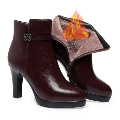 Dark maroon leather ankle boots with high block heels, platform soles, decorative ankle straps, and furry interior lining.