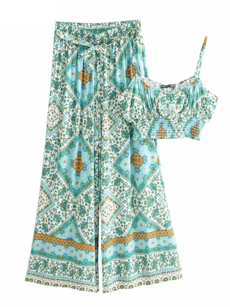 Blue and white floral print flowy two-piece set with a smocked crop top and high waist drawstring wide leg pants.