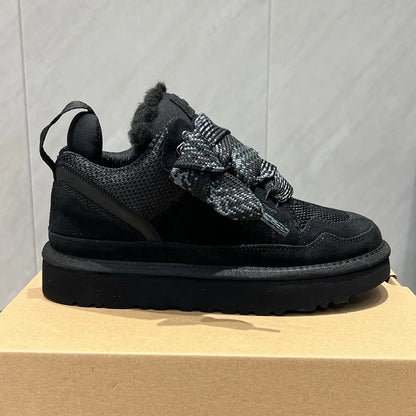 Black suede platform boots with thick grey patterned laces and cushioned soles for comfortable all-day streetwear wear.