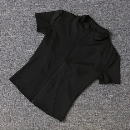 Black fitted polyester sports jacket with a zip front for running, cycling, and yoga.