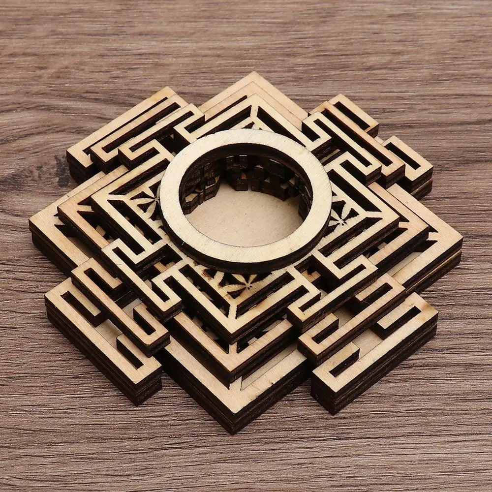Light brown wooden crystal ball stand with layered, geometric lotus-style cutouts and a circular center ring.