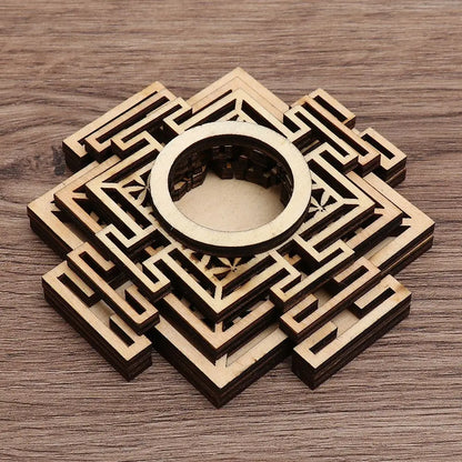 Light brown wooden crystal ball stand with layered, geometric lotus-style cutouts and a circular center ring.